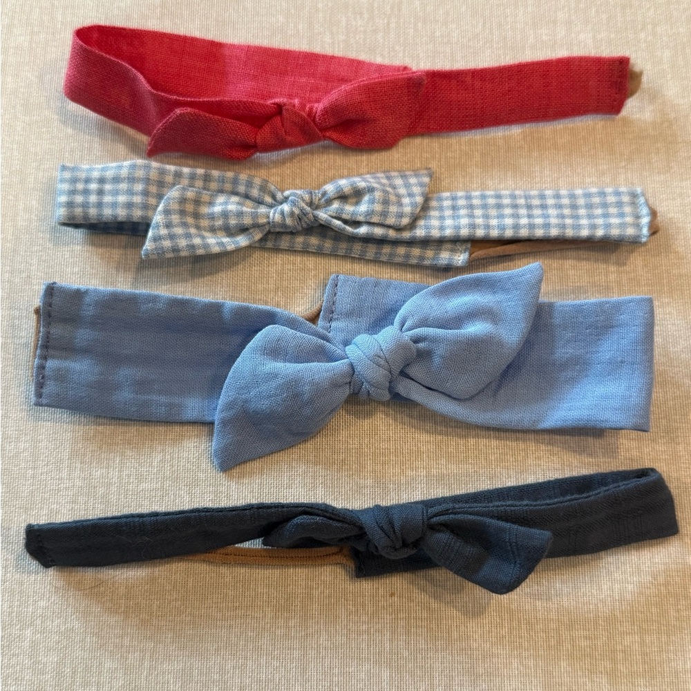 Set of 4 Wunderkin soft baby headbands.